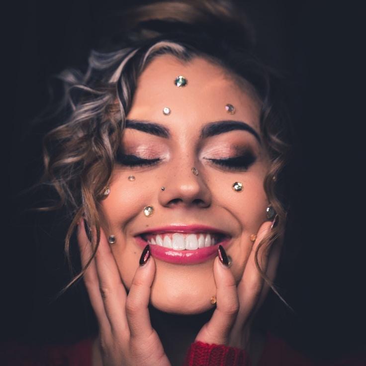 Kaveri Mehta, Lead Design Curator at Ember Spruce Trail, reviewing corporate floral arrangements